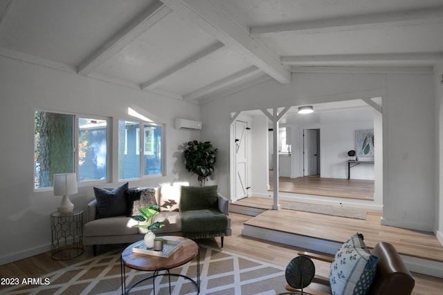 living room featuring a wall mounted air conditioner, light hardwood / wood-style floors, and vaulted ceiling with beams