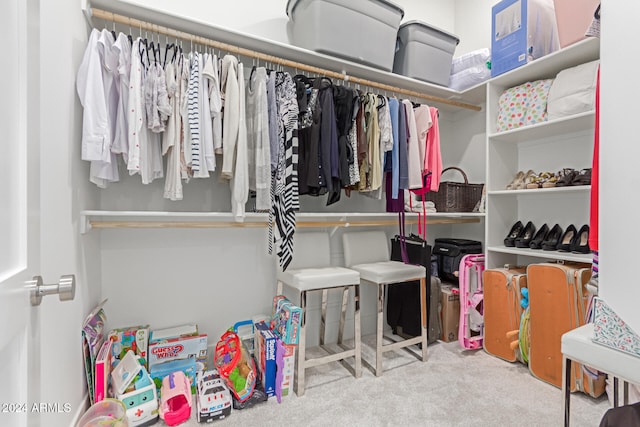 spacious closet with carpet flooring