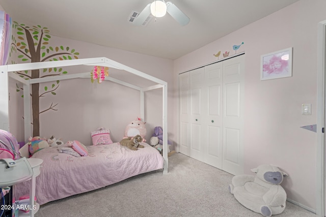 bedroom featuring carpet floors, a closet, vaulted ceiling, and ceiling fan