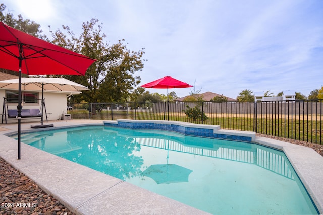 view of swimming pool with a patio area