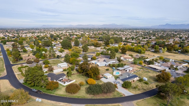 birds eye view of property with a mountain view