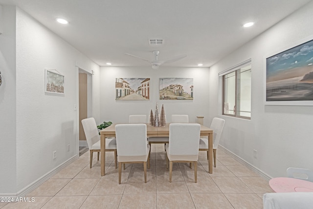 dining space with ceiling fan and light tile patterned floors