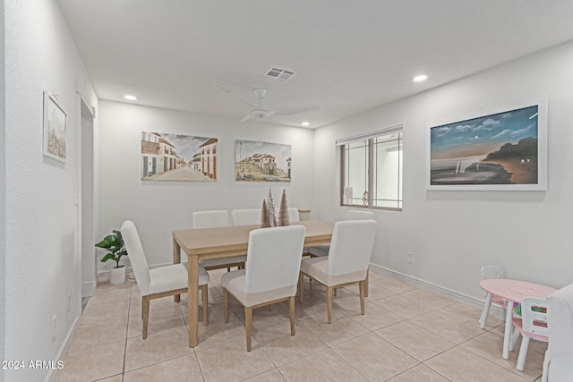 dining area with light tile patterned floors and ceiling fan