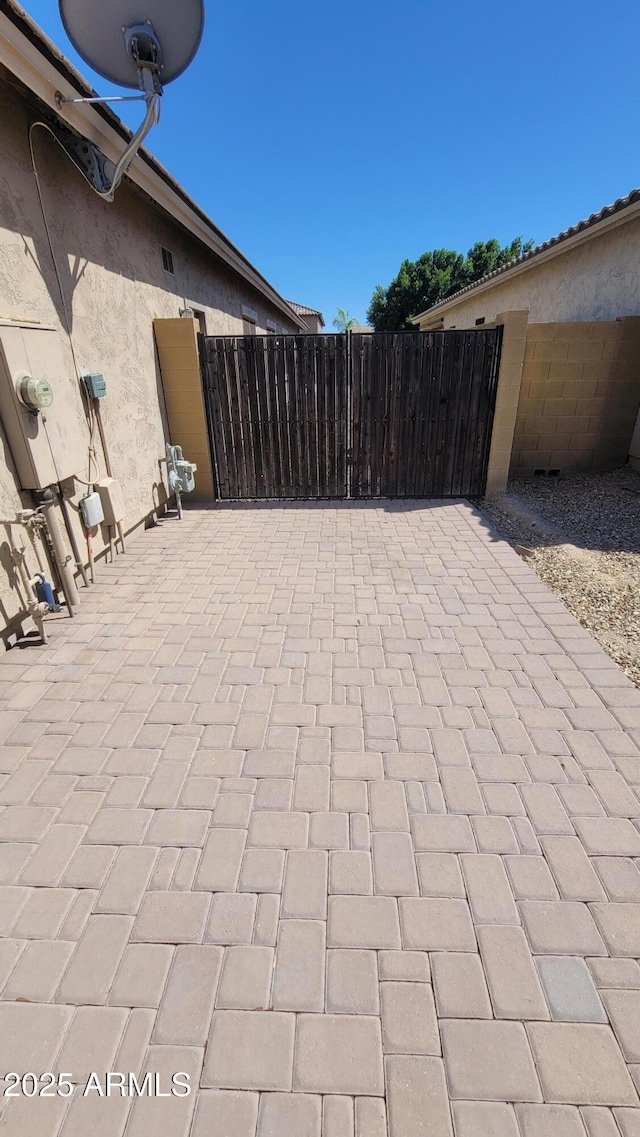 view of patio / terrace featuring fence