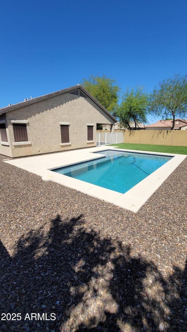 view of pool featuring a fenced backyard and a patio