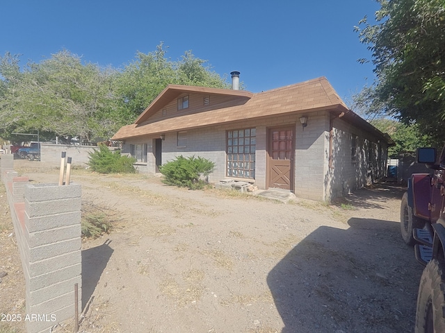 5463 E Roberts Dr, Globe, AZ 85501 - view of front of home with concrete block siding and a shingled roof