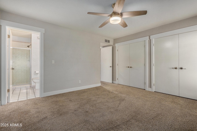 2228 E Campbell Ave Unit 116, Phoenix, AZ 85016 - unfurnished bedroom with light carpet, connected bathroom, multiple closets, and ceiling fan