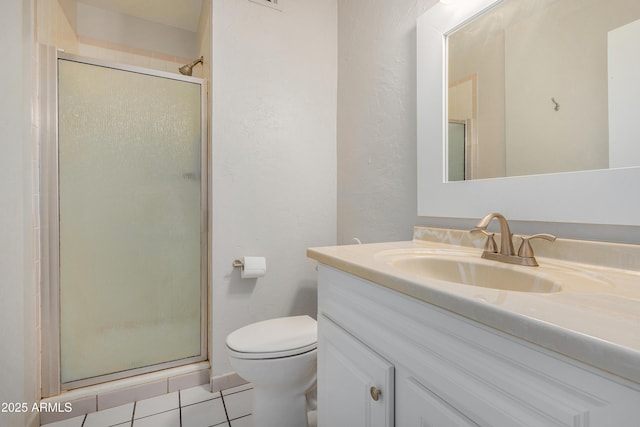 2228 E Campbell Ave Unit 116, Phoenix, AZ 85016 - bathroom featuring vanity, an enclosed shower, tile patterned floors, and toilet