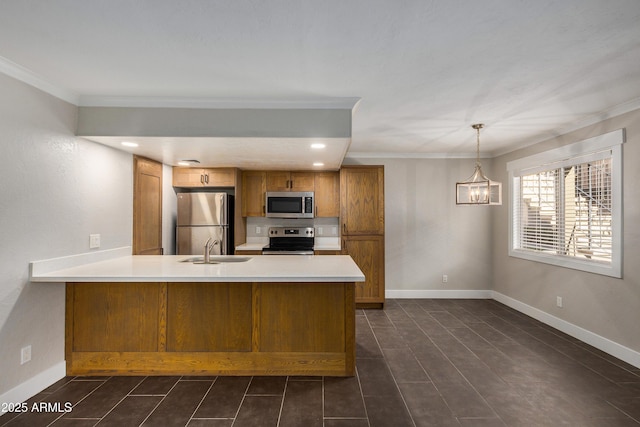 2228 E Campbell Ave Unit 116, Phoenix, AZ 85016 - kitchen featuring sink, crown molding, appliances with stainless steel finishes, kitchen peninsula, and pendant lighting