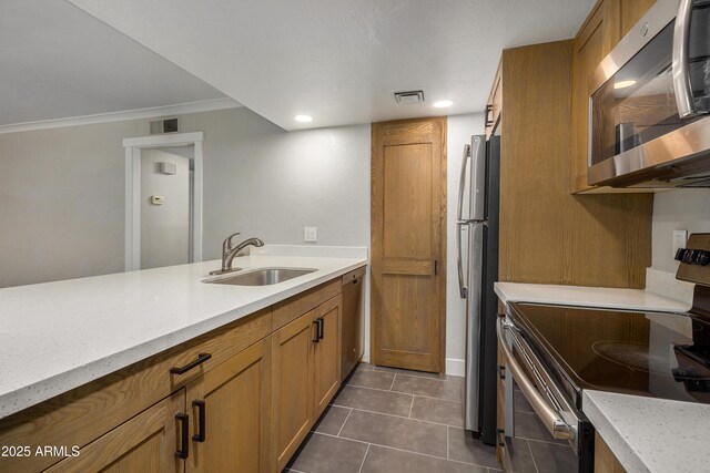 2228 E Campbell Ave Unit 116, Phoenix, AZ 85016 - kitchen featuring stainless steel appliances, sink, and dark tile patterned flooring