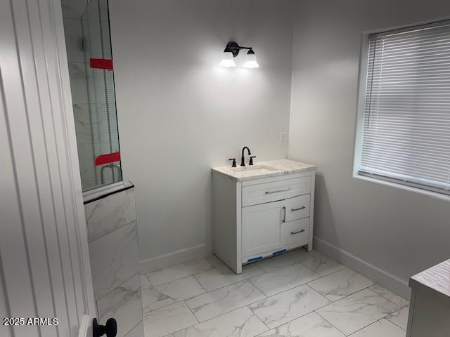 6633 N 54th Dr, Glendale, AZ 85301 - full bathroom featuring tiled shower, marble finish floor, vanity, and baseboards