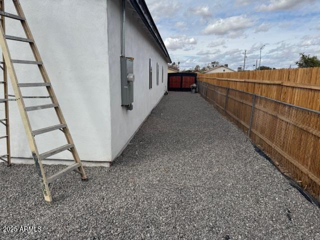 6633 N 54th Dr, Glendale, AZ 85301 - view of side of property with stucco siding and fence
