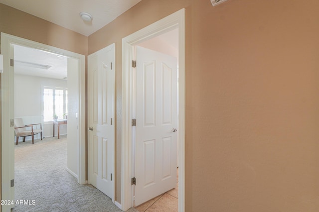 corridor with light carpet