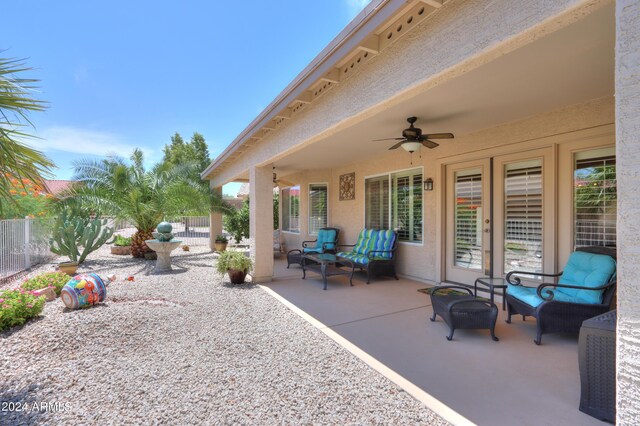 view of patio featuring ceiling fan