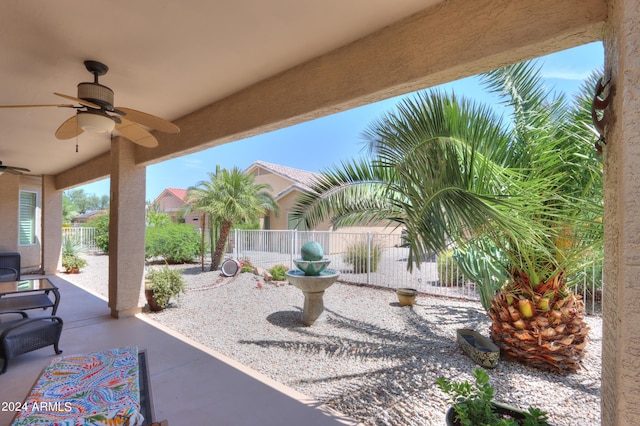 view of patio / terrace with a fenced backyard and ceiling fan