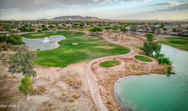 birds eye view of property featuring golf course view and a water and mountain view