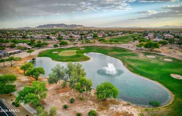 aerial view featuring golf course view and a water and mountain view