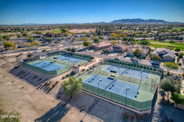 birds eye view of property with a mountain view