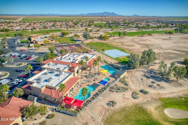 birds eye view of property with a mountain view