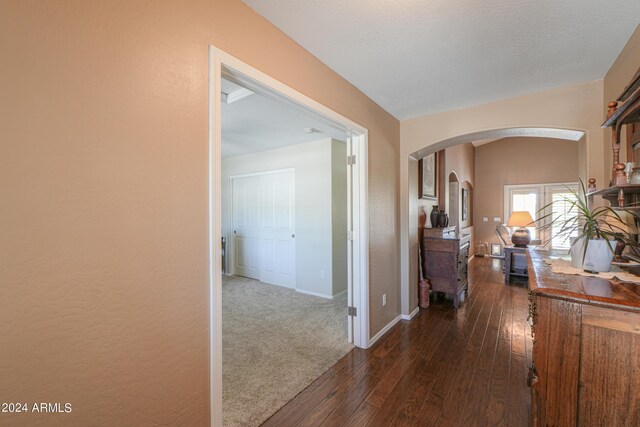 hall featuring dark wood-type flooring