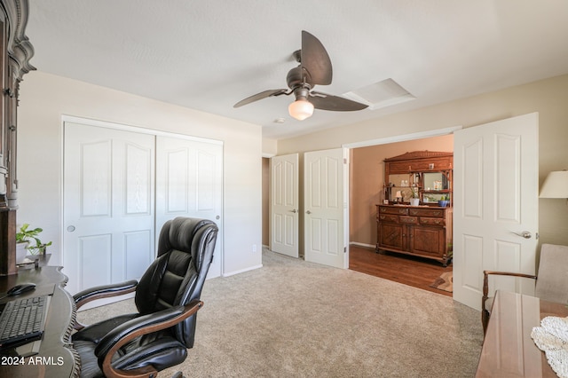 office space featuring carpet, baseboards, and ceiling fan