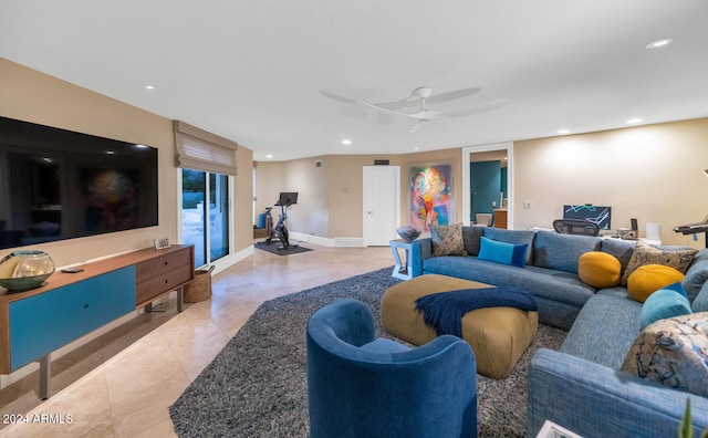 tiled living room featuring ceiling fan