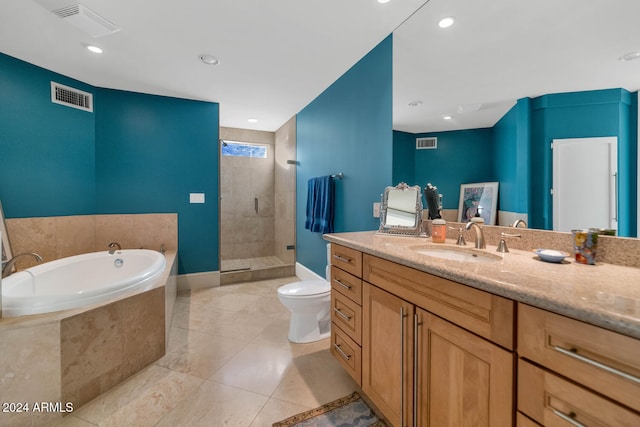 full bathroom featuring tile patterned flooring, vanity, shower with separate bathtub, and toilet