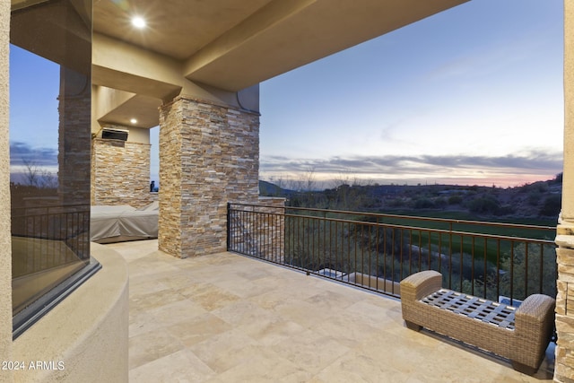 view of balcony at dusk