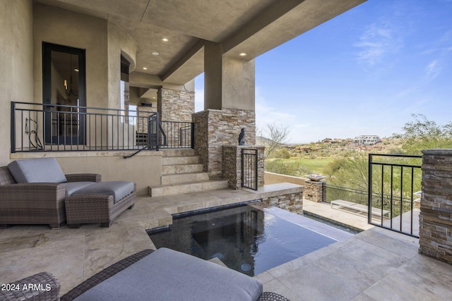 view of patio / terrace with a fenced in pool