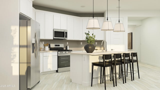 4808 S 232nd Ln, Buckeye, AZ 85326 - kitchen with appliances with stainless steel finishes, a kitchen island with sink, a sink, light countertops, and white cabinetry