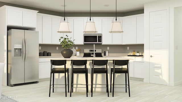 4808 S 232nd Ln, Buckeye, AZ 85326 - kitchen featuring appliances with stainless steel finishes, light wood-style flooring, a kitchen island, and white cabinets