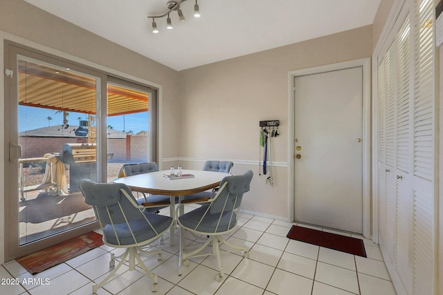 dining space featuring light tile patterned floors