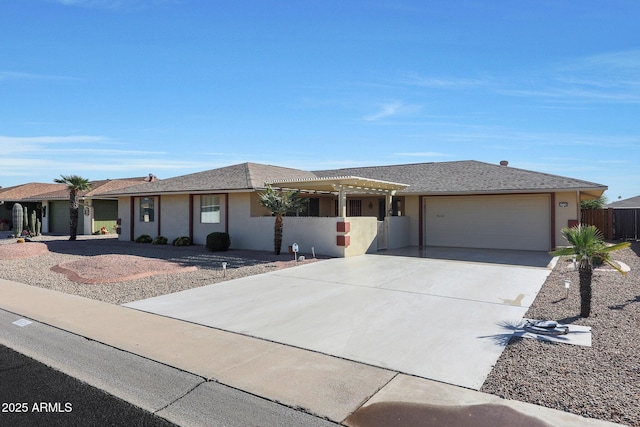 ranch-style house featuring a garage and a pergola