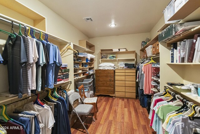 walk in closet featuring hardwood / wood-style flooring