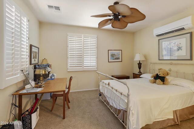 bedroom featuring ceiling fan, light carpet, a wall mounted air conditioner, and multiple windows