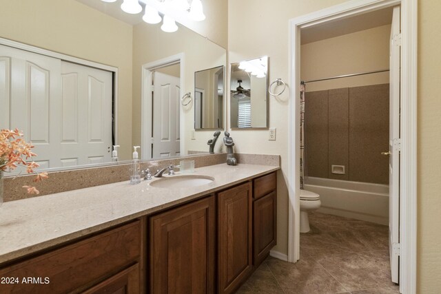 full bathroom featuring tile patterned flooring, washtub / shower combination, ceiling fan, vanity, and toilet