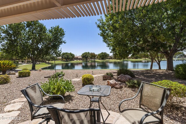 view of patio featuring a water view