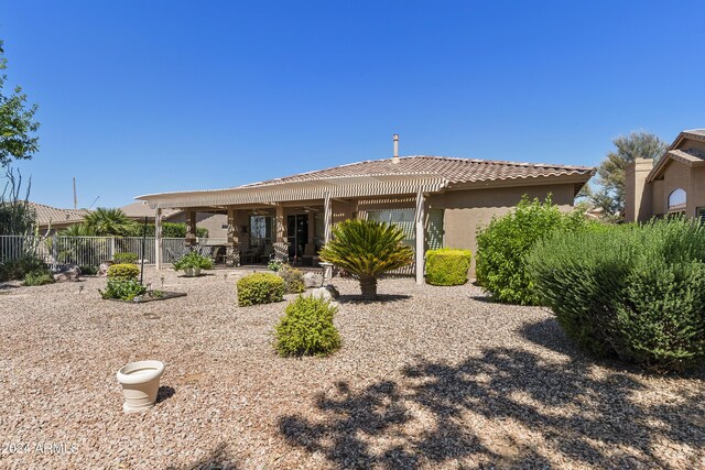 back of house with a patio