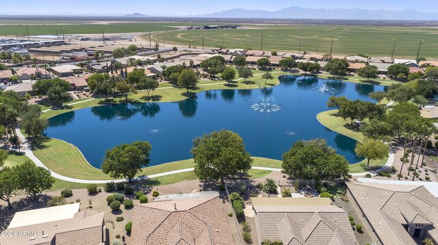 birds eye view of property featuring a water and mountain view