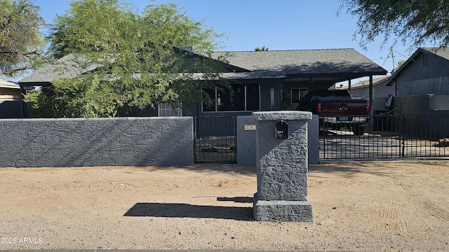265 W 17th Ave, Apache Junction, AZ 85120 - view of front facade featuring a fenced front yard, a gate, and roof with shingles