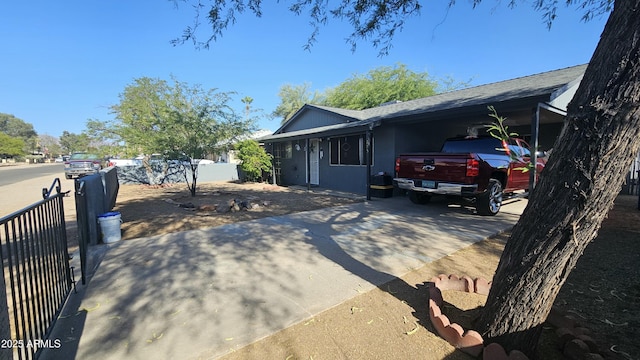 265 W 17th Ave, Apache Junction, AZ 85120 - view of home's exterior featuring concrete driveway, an attached carport, and a shingled roof