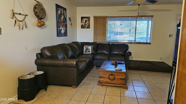 265 W 17th Ave, Apache Junction, AZ 85120 - living room featuring light tile patterned flooring, a ceiling fan, and a textured ceiling