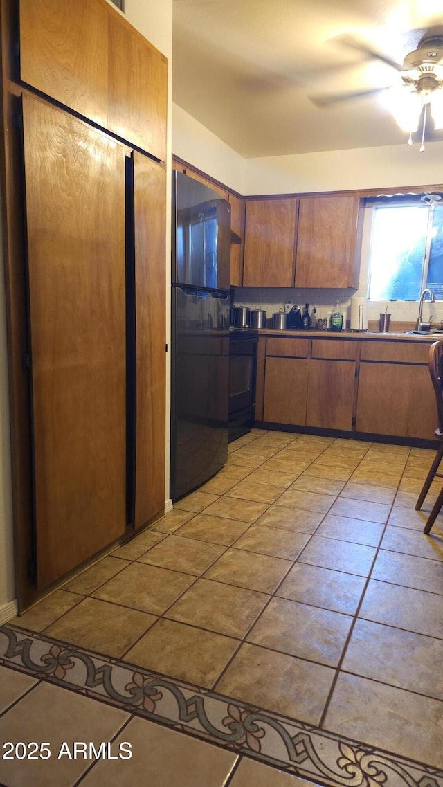 265 W 17th Ave, Apache Junction, AZ 85120 - kitchen featuring freestanding refrigerator, light tile patterned floors, ceiling fan, and range