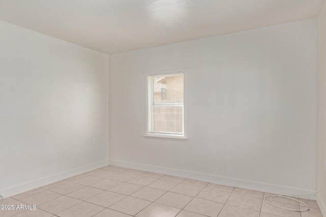 empty room featuring light tile patterned flooring