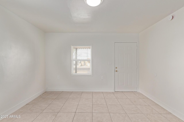 empty room featuring light tile patterned flooring