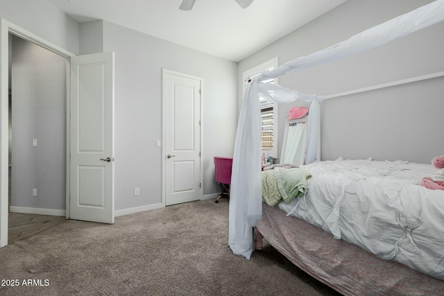 bedroom with carpet floors, baseboards, and a ceiling fan