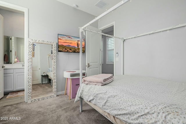 carpeted bedroom featuring visible vents