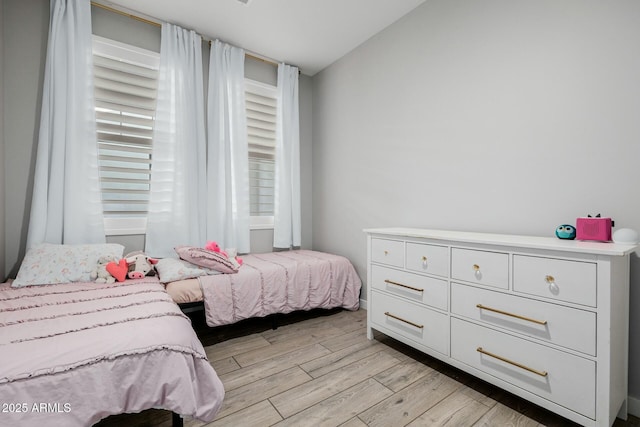 bedroom featuring light wood-style floors