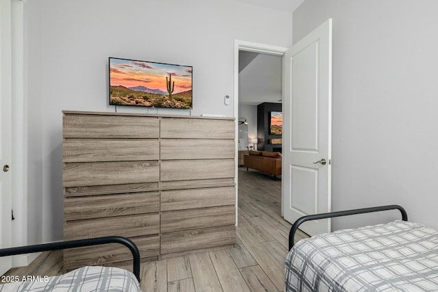 bedroom featuring wood finished floors