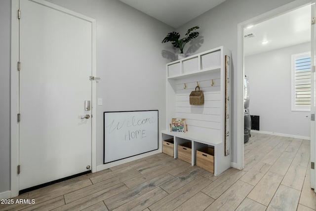 mudroom with baseboards, visible vents, and light wood-style floors